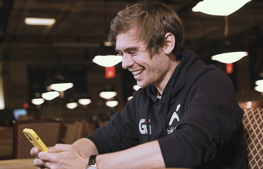 Fedor Holz is seen smiling as he looks down at his phone. he's wearing a black ggpoker hoodie. GG's new online poker tool rates your play and gives coaching advice immediately after you have played your hand -- but it doesn't come cheap.