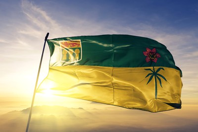 the saskatchewan flag is seen flying in the breeze against a sunny blue sky. Canada Poker Network to Expand to Saskatchewan