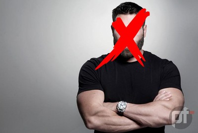 Womanizer, playboy, and controversial figure Dan Blizerian stands smugly with his arms crossed in front of a grey background. He has a large red X over his face, representing GGpoker X'ing him out of their ambassador roster. pokerfuse watermark on bottom