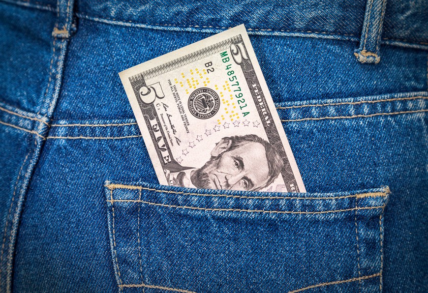 A $5 bill is seen sticking out the pocket of a pair of blue jeans. Start Small, Win Big: Best Low Minimum Deposit Casinos USA -- Start your online casino journey for as little as $5!